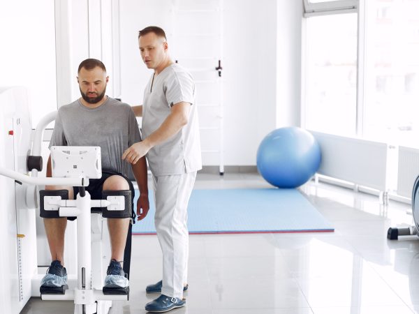 Doctor with a patient in physiotherapy clinic