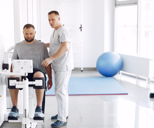 Doctor with a patient in physiotherapy clinic